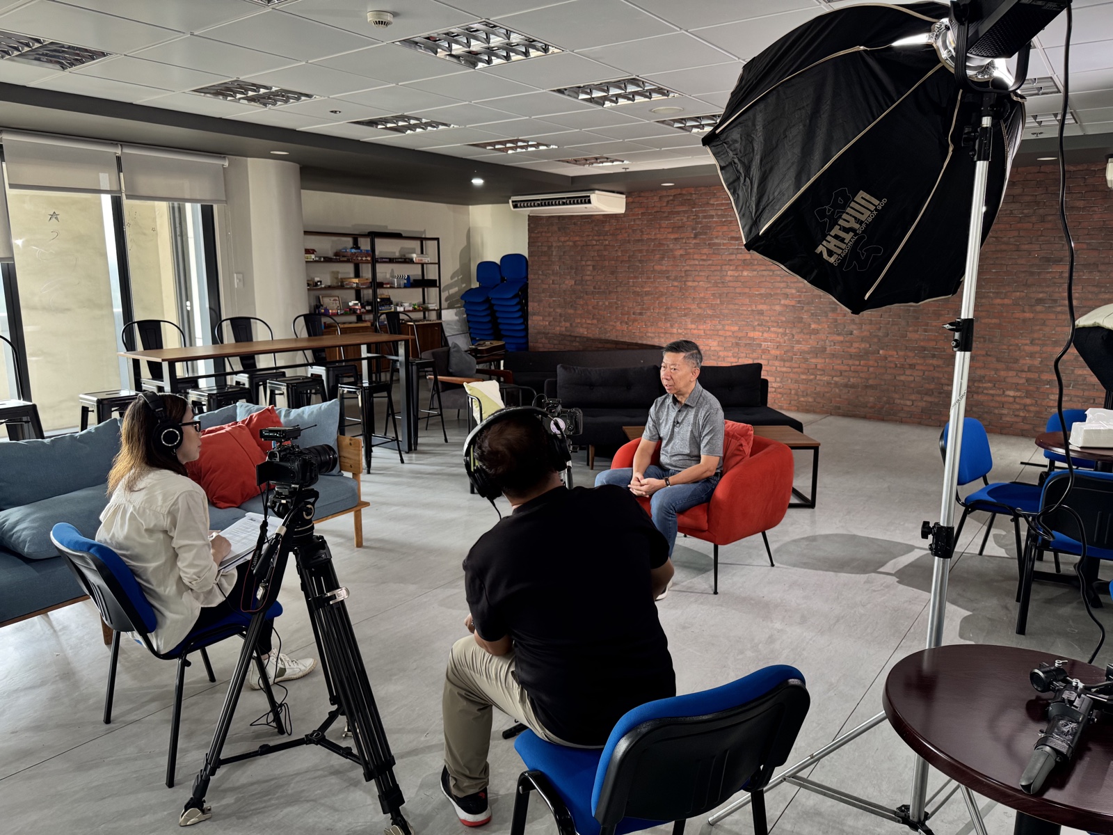 CREVO team filming an interview on location