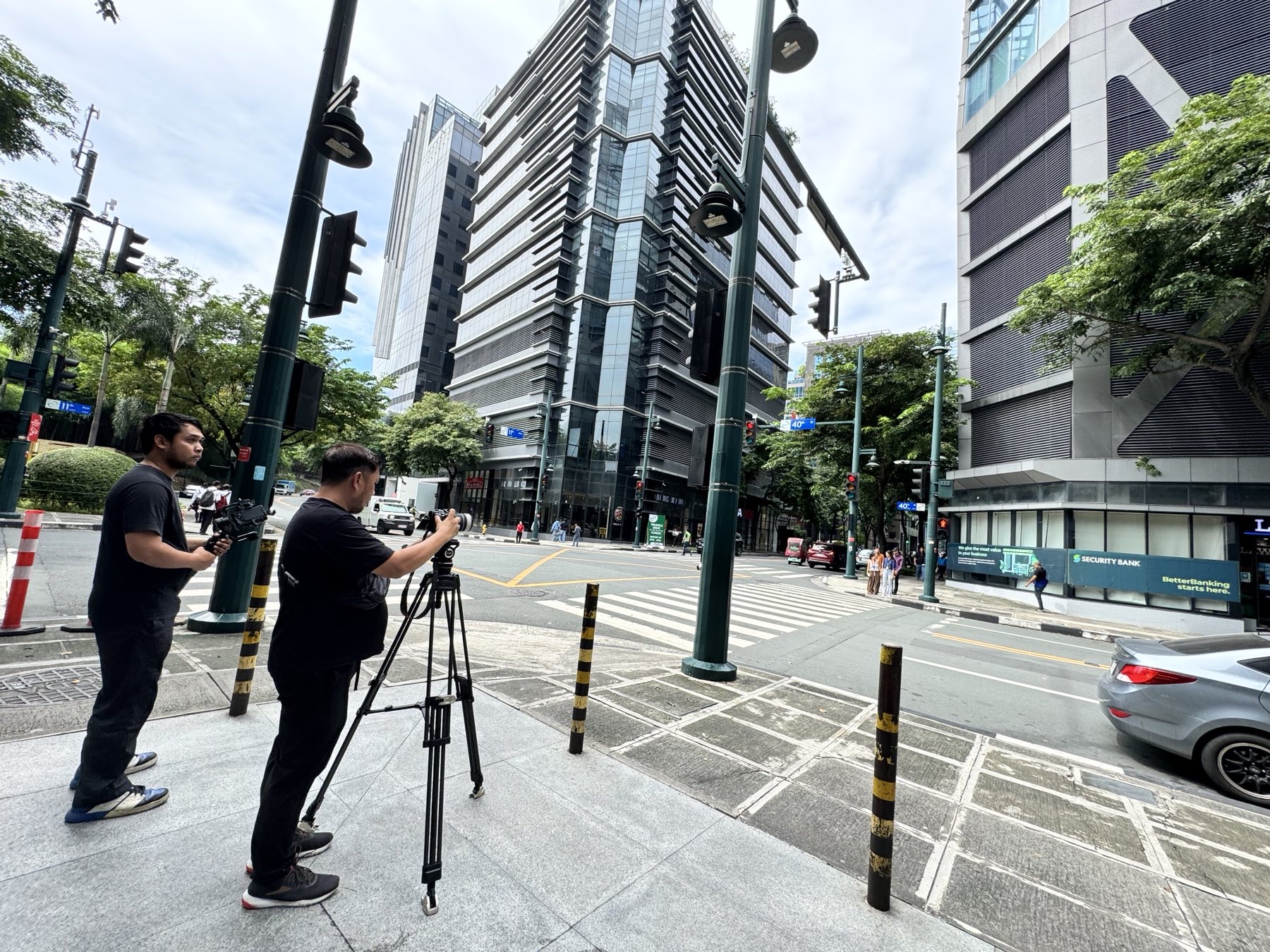 CREVO production crew filming on a city street