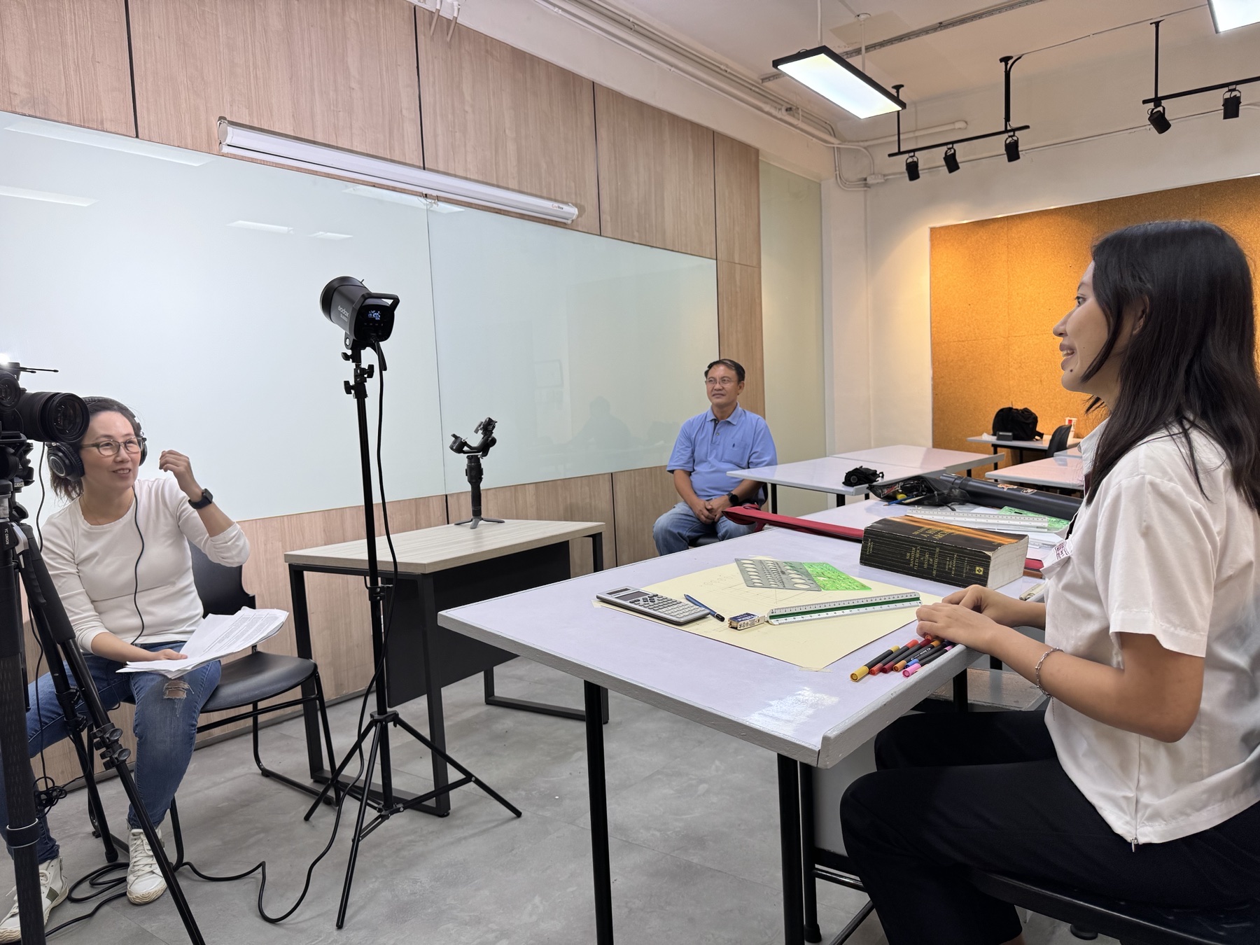CREVO filming an interview in a classroom setting