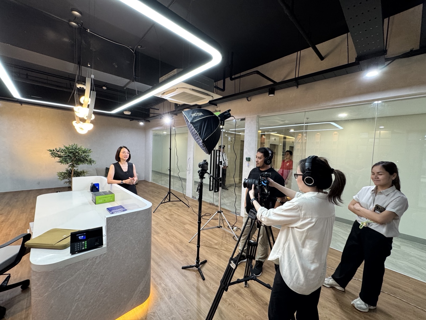 CREVO filming an interview in a modern office